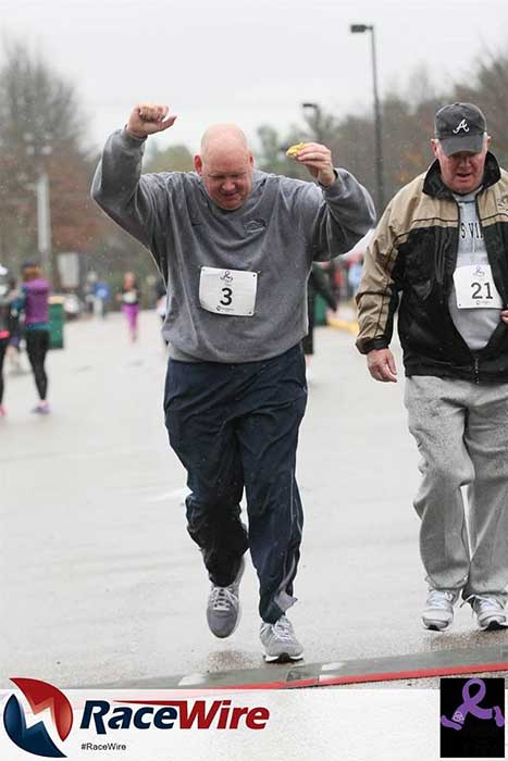 Elder man running in a race